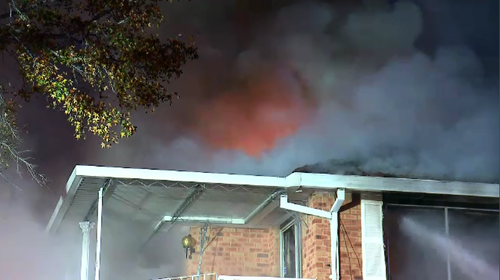 A fire completely engulfed the second storey of a home in Sydney's west early this morning.