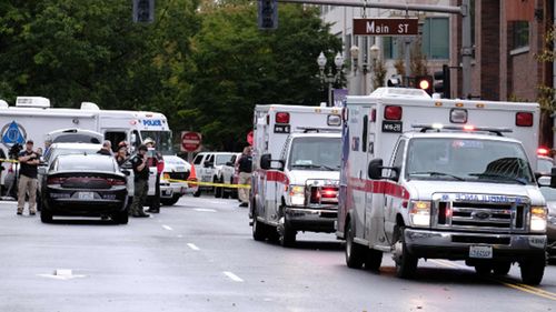 Police respond to a shooting at the Smith Tower Apartments in Vancouver.