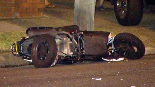 The scooter lying on the street following the crash last night.