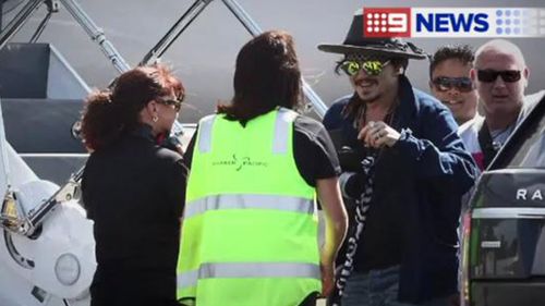 Depp chats to airport staff. (INF Photo)