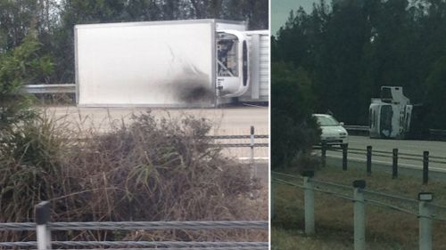 A truck and police car crashed on the Pacific Motorway. (Zak Redmond)