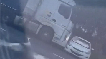 A﻿ truck has been captured on video pushing a car sideways along the Bruce Highway.