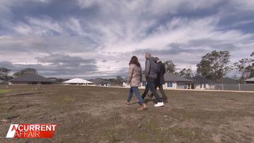 Melissa and Bryan looking at their lot of land.