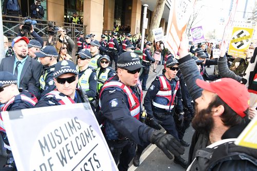 Chaotic scenes outside the Melbourne Magistrates Court. (AAP)