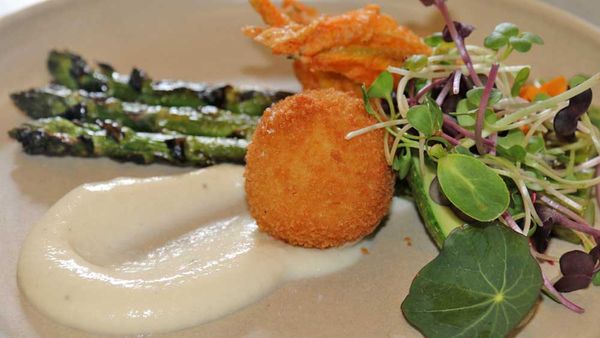 Stuffed zucchini flowers with crumbed quail eggs, garden asparagus and celeriac puree 