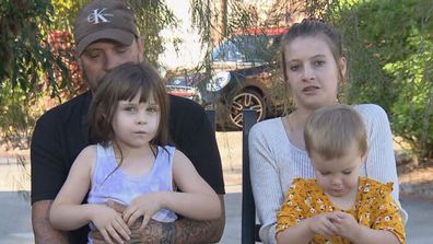 Azarliah Jones (bottom left) and her parents Simon and Alana on two-year wait for appointment over ear condition requiring surgery