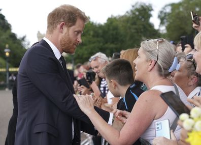 Britain's Prince Harry meets members of the public on a walkabout at Windsor Castle, following the death of Queen Elizabeth II on Thursday, in Windsor, England, Saturday, Sept. 10, 2022. (Kirsty O'Connor/Pool Photo via AP)