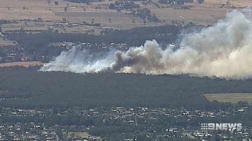 Bush fires fanned by strong, hot winds quickly spread.