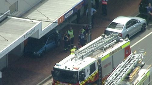 Elderly driver smashes through Sydney shopfront