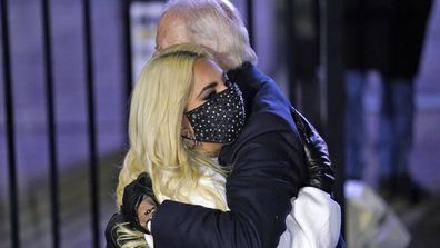 Democratic presidential candidate former Vice President Joe Biden hugs Lady Gaga during a drive-in rally at Heinz Field, Monday, Nov. 2, 2020, in Pittsburgh