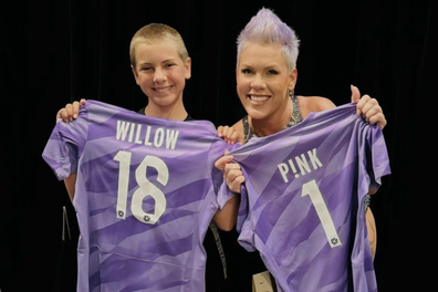 Pink and her daughter Willow with their personalised Matildas goalkeeper jerseys.