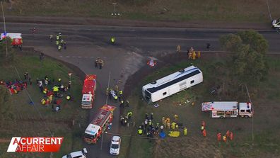 A group of tradies have been hailed as heroes after they ran towards danger to rescue terrified children from a bus.