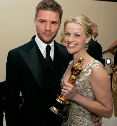 Actress and winner Reese Witherspoon poses with her Oscar and husband Ryan Phillippe