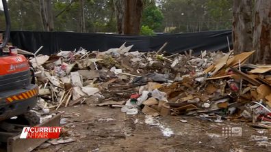 The NSW environmental watchdog and a local council have launched investigations into an apparent rubbish dump which suddenly appeared on a residential street in south-west Sydney.