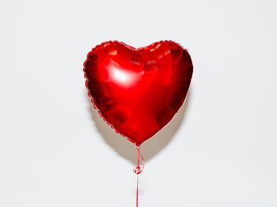 Red heart shaped helium balloon