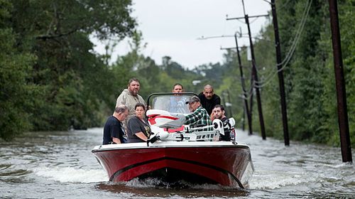 Boats evacuate residents from the floods around Beaumont in Texas. (Photo: AP).