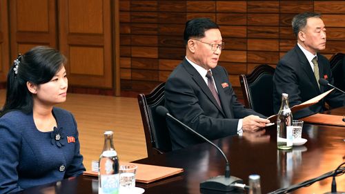 Head of North Korean delegation Kwon Hyok Bong, center, and Hyon Song Wol, the head of the Moranbong Band, left.