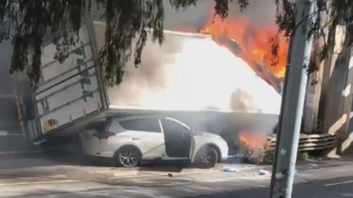 The truck had crashed into a bridge on Mt Alexander Road before toppling on its side and catching alight.