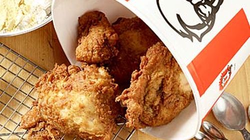 KFC chicken spilling out of bucket (Getty)