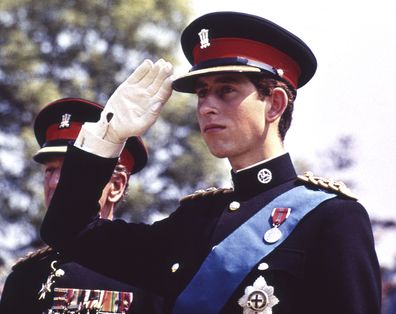 FILE  - In this June 11, 1969 file photo, Britain's Prince Charles, dressed in the uniform of the Colonel in Chief of the Royal Regiment of Wales, salutes at the Regiment's Colour presentation, at Cardiff Castle in Wales. It was the first occasion for the Prince to wear uniform. Prince Charles has been preparing for the crown his entire life. Now, that moment has finally arrived. Charles, the oldest person to ever assume the British throne, became king on Thursday Sept. 8, 2022, following the de