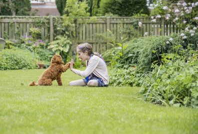 Girl with pet dog