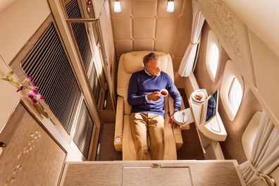 In first class suites on Emirates' Boeing 777-300ERs, a body-cradling seat reclines into a bed, which is pictured at the top of this story.