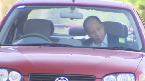 Robert Xie in his wife's car after leaving prison. (9NEWS)