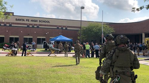 Law enforcement and medical personnel outside Santa Fe High School. Picture: EPA