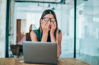 Woman stressed at work.