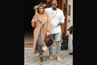 Looking comfortably chic in a long tan coat, the reality star paired her low-key look with a pair of lace-up booties, a nude Balenciaga bag and a trendy fedora hat to complete her super-cool street-style.<br/><br/>Source: Getty