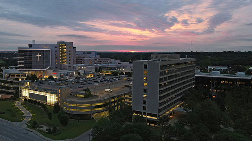 The sun rises over the St. Francis Hospital campus, Thursday, June 2, 2022, in Tulsa, Oklahoma. 