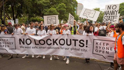 Demonstrators hold a banner saying No Lockouts! as thousands gather in Sydney's CBD on February 21, 2016 to protest against the New South Wales Government's lockout laws in the inner city during Keep Sydney Open rally. (AAP)