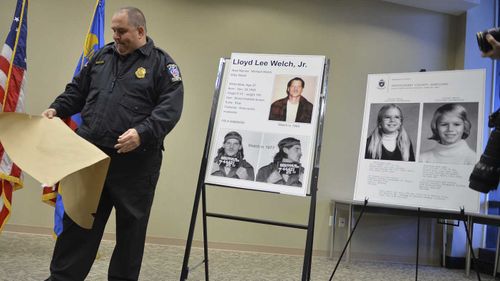 In this Feb. 11, 2014 file photo, Montgomery County Police Officer Robert Ladan uncovers photos of Lloyd Lee Welch Jr. (AP)