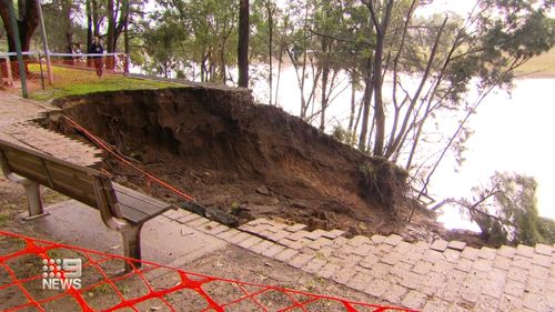 The riverbank has disappeared after flooding in Windsor, NSW.