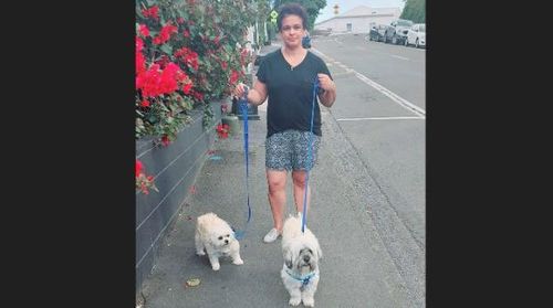 Nuzia Scaranci with her dogs Ruby, left, and Simba, right.