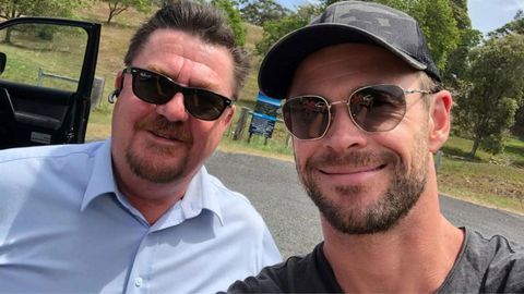 Harcourts agent Steve Leslie with Aussie star Chris Hemsworth, at the block of land the Thor actor toured in Broken Head, New South Wales.