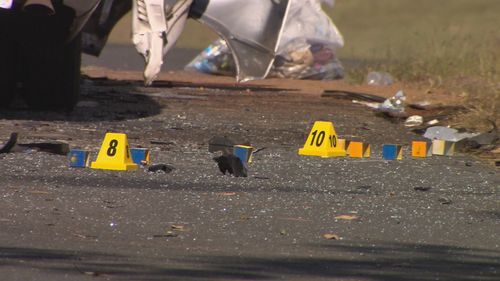 Glass and debris were strewn across the road, which was closed for most of the day.