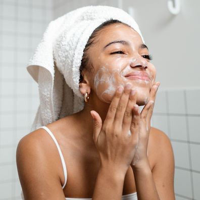 Woman washing her face