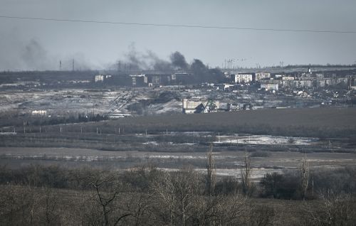 Smoke raises after shelling in Soledar, Donetsk region, Ukraine, Wednesday, Jan. 11, 2023. 