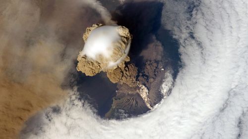 Eruption of Sarychev Peak Volcano, Kuril Islands, north-eastern Japan on 12 June, 2009. The white matter on the side of the volcano is pyroplastic flow, as viewed from the International Space Station. (NASA)