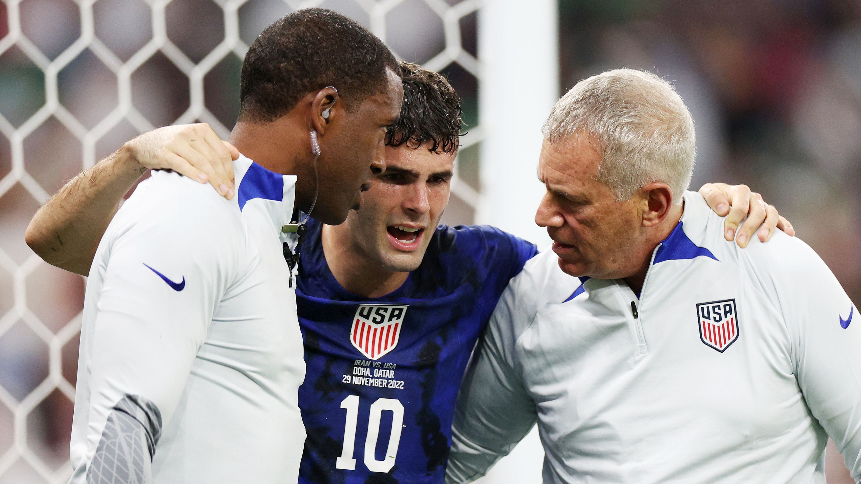 DOHA, QATAR - NOVEMBER 29: Christian Pulisic of United States receives medical treatment after scoring their sides first goal during the FIFA World Cup Qatar 2022 Group B match between IR Iran and USA at Al Thumama Stadium on November 29, 2022 in Doha, Qatar. (Photo by Dean Mouhtaropoulos/Getty Images)