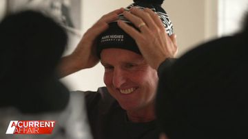 Former footy player Mark Hughes wearing one of his MHF beanies.
