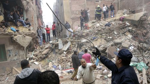 At least 17 dead after 'illegally built' building collapses in Cairo