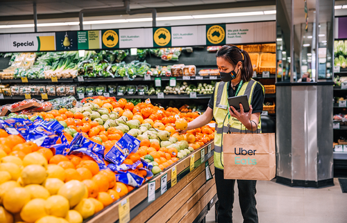Woolworths personal shoppers collecting groceries for Uber Eats