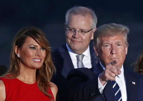 US President Donald Trump, his wife Melania Trump and Australian Prime Minister scott Morrison pose for the leaders photo during the G7 summit in Biarritz, France.