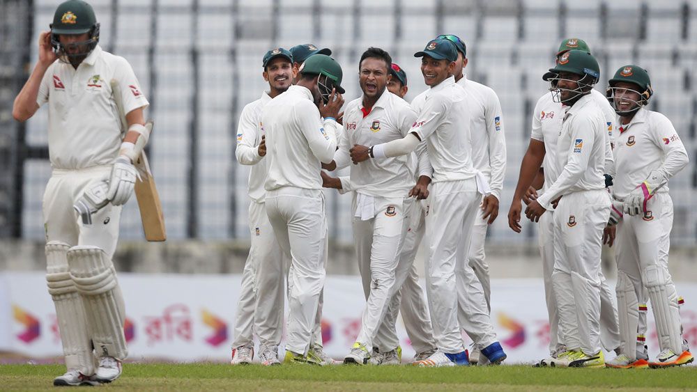 Shakib Al Hasan lets Nathan Lyon know of his feelings in the first Test in Dhaka. (AAP)