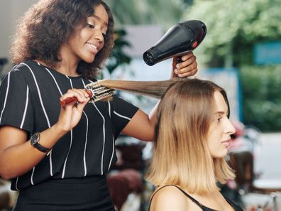 Woman at hairdressing salon