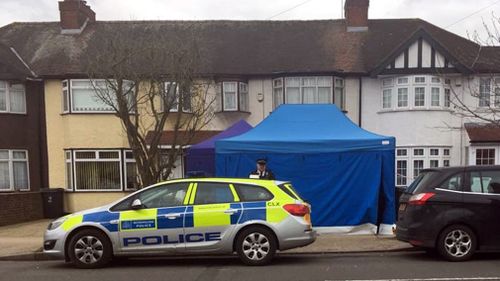 Police swarm the property in New Malden in London's south west. (PA/AAP)
