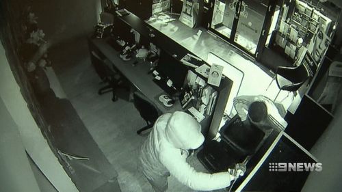 A group of thieves used a boulder to break into two businesses in Melbourne's Kew.