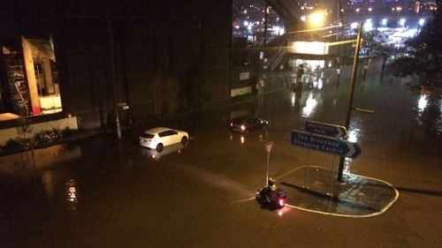 9NEWS reader Robert Anderson sent in this photo of a motorist stuck in floodwaters in Glebe in Sydney's inner-west.